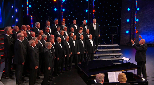 Rhos Male Voice Choir singing in a concert